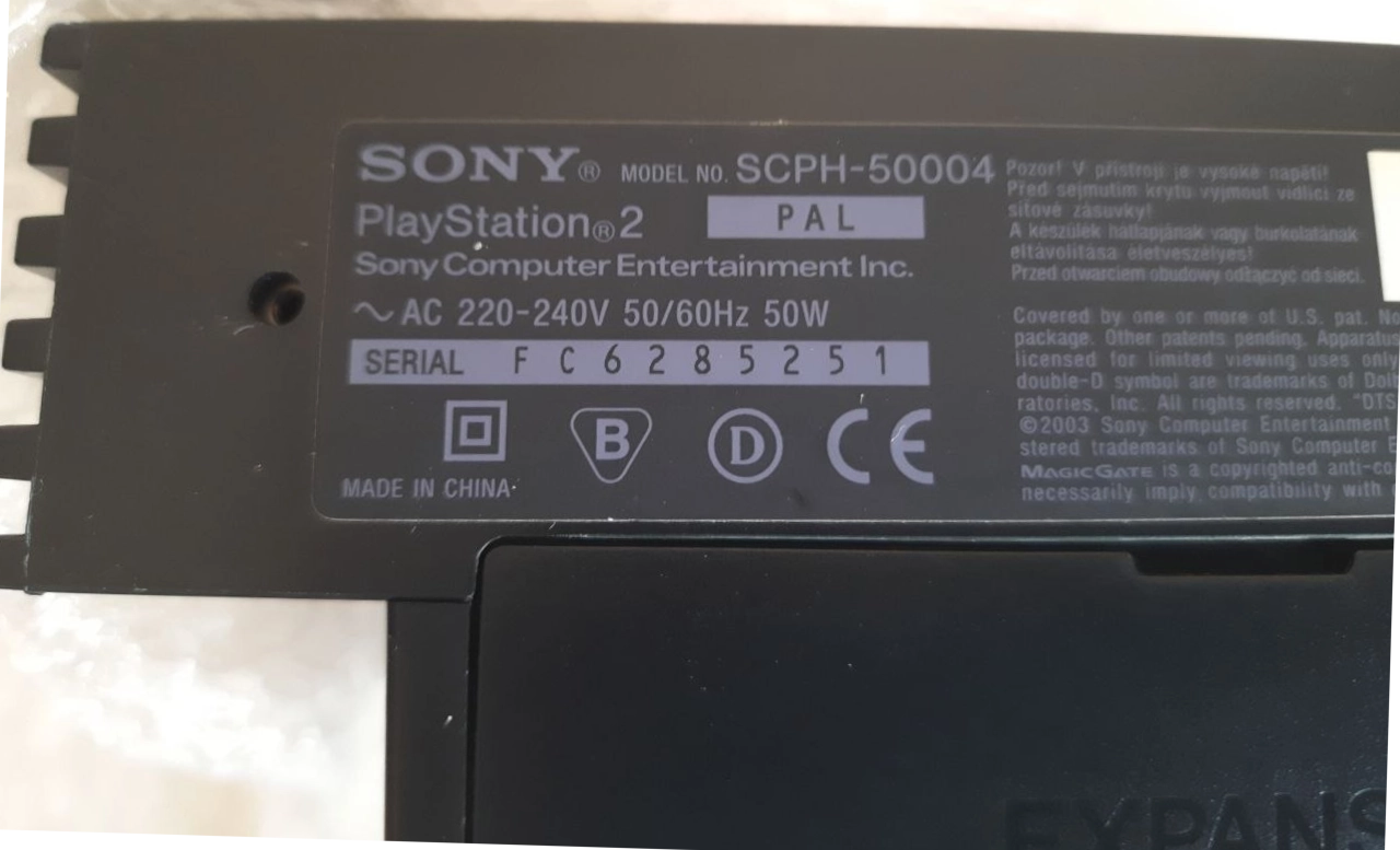 Back of a PS2, with the label showing the model (SCPH-50004). Below it is the expansion bay for the HDD and Network Adapter. Back of a PS2, with the label showing the model (SCPH-50004). Below it is the expansion bay for the HDD and Network Adapter.