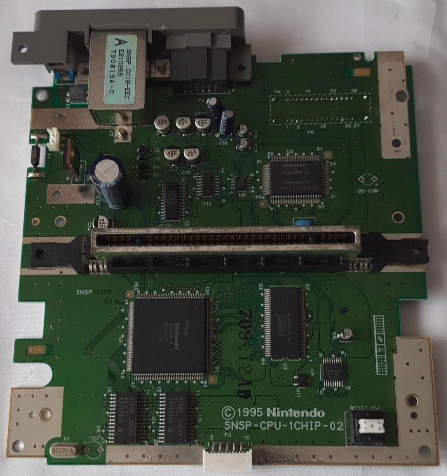 A SNES motherboard with all covers removed. The revision is evident (lower right). A SNES motherboard with all covers removed. The revision is evident (lower right).